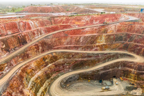 Open cut Gold mine, with Haul truck driving up road. Located in Cobar NSW Australia.